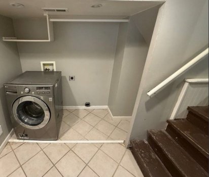 Stairs Leaving Laundry_Garage-Level 1 to Kitche_Living Room-Level  1.jpg